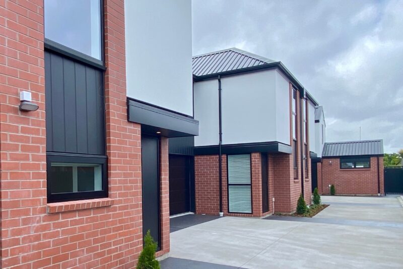 Driveway, side view of houses.